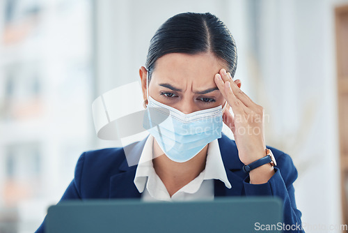 Image of Headache pain from covid, tired and burnout business woman working on laptop with mask, stress about work problem and mistake. Manager, employee and worker with migraine, thinking and frustrated