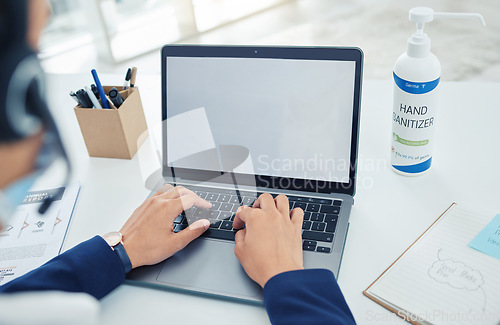 Image of Business, hands and employee at the office on a laptop working in customer support at the workplace. Worker typing on computer at work in a call center, contact us and service role with technology.