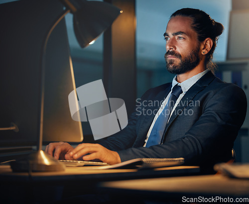 Image of Working, typing and computer research of a seo and cryptocurrency technology developer working late. Web development of a fintech software worker planning iot and erp digital transformation at night