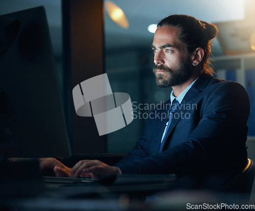 Image of Business, office and night with a corporate employee working on a computer and the internet in a company. Technology and networking for global communication or an international deal across time zones