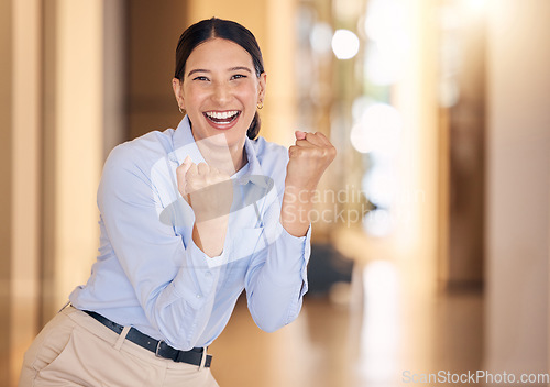 Image of Business woman cheering with fist for success, winning and bonus achievement in startup agency. Portrait of happy, lucky and excited sales worker for celebration deal, trading motivation and joy