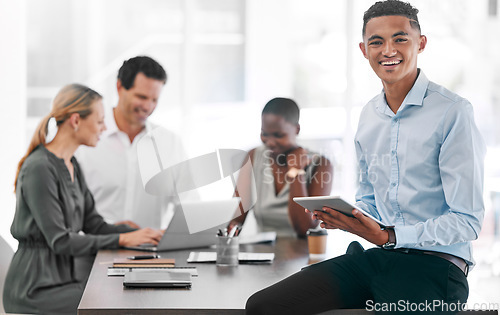 Image of Portrait of a happy businessman smile with a tablet in a team planning meeting at work. An employee in an office with his team as they discuss strategy or plans, and strategies in a corporate office