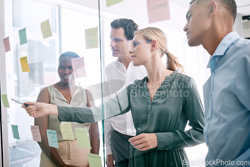 Image of Corporate, sticky notes and business people planning a team mission, project or growth of business plan. Diversity, collaboration and creative employees having a strategy, idea and solution meeting.