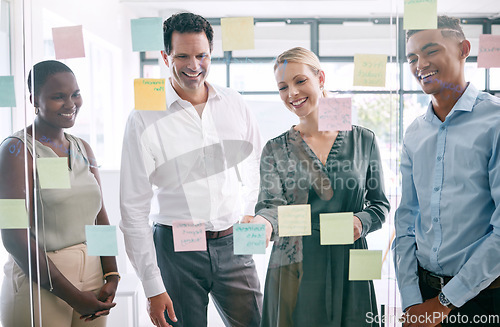 Image of Planning, sticky notes and diversity marketing business people working in partnership, collaboration and strategy meeting. Thinking, innovation and team work on glass wall for media advertising idea