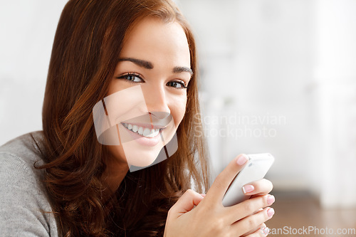 Image of Relax woman, phone and social media search, internet news or mobile dating app in home or house. Smile, happy or portrait of beauty person with communication technology for networking in living room