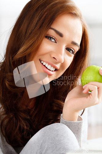 Image of Healthy diet, eating fresh green apple and fruit nutrition for wellness food, vitamins and fibre. Portrait face of a young, beautiful and happy woman, vegan and nutritionist hungry for organic snack