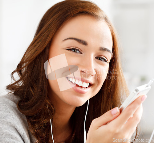 Image of Woman streaming music with smartphone technology, audio content on headphones and browse internet on weekend. Happy girl listening to podcast at home, healthy skin natural beauty and portrait closeup