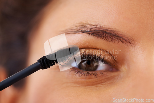 Image of Beauty, cosmetics and eye lash curling makeup on woman face portrait, getting ready and grooming in the morning. Closeup of a woman apply mascara, glamour look and natural eyelash extensions care
