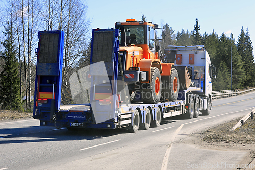 Image of Semi Trailer Truck Hauls Wheel Loader