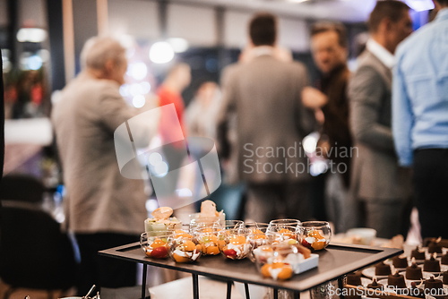 Image of Blurred image of businesspeople at banquet business meeting event. Business and entrepreneurship events concept. Focused on the canapes.