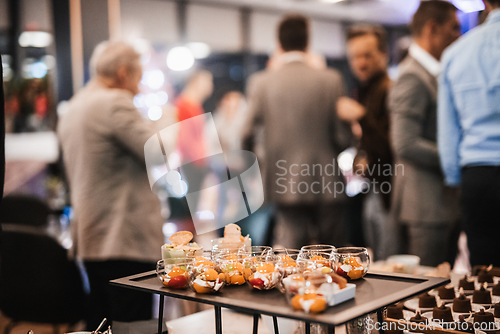 Image of Blurred image of businesspeople at banquet business meeting event. Business and entrepreneurship events concept. Focused on the canapes.