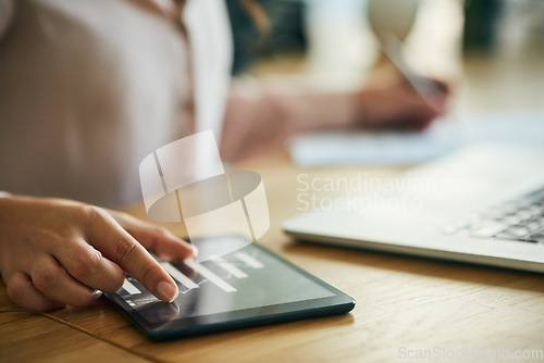 Image of Hand, graph and technology while a woman zoom in on a tablet to check the growth and development of her company. Closeup of a businesswoman, data analyst and accountant checking financial charts