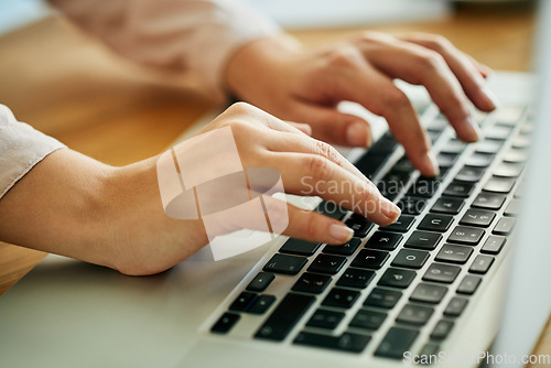 Image of Woman typing on a laptop keyboard working on a report, email or online research for website about us information. A productive female marketing analyst hands doing seo data work with modern software