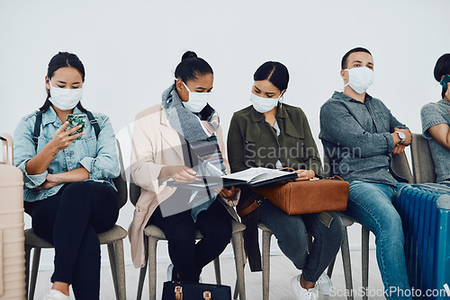 Image of Immigration during covid with people traveling and waiting at an airport lounge during the pandemic. Foreign refugees in a public travel facility or border wearing masks in a corona virus outbreak