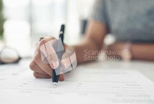 Image of Writing, reading and making notes on finance, investment or tax contract and paperwork in an office. Hands closeup of a female financial worker planning, signing and working on banking forms