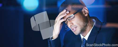 Image of Headache, burnout and stress business man working late in corporate office. Workaholic feeling the pressure of workload and deadline, frustrated and suffering with migraine and exhausted by overtime