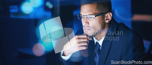 Image of Businessman working, thinking and planning at night in a corporate company office. Networking for global communication or an international deal across time zones while trading with data and analytics