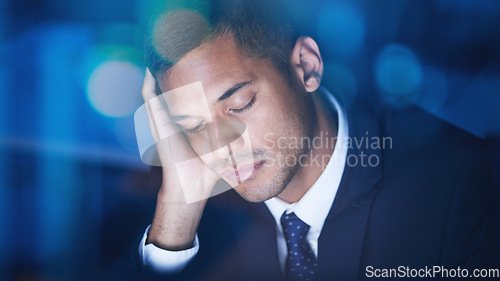 Image of Tired, overworked and exhausted businessman sleeping while working overtime in the office at night. Fatigue, burnout and lazy corporate manager sitting at desk and taking nap in the company building.