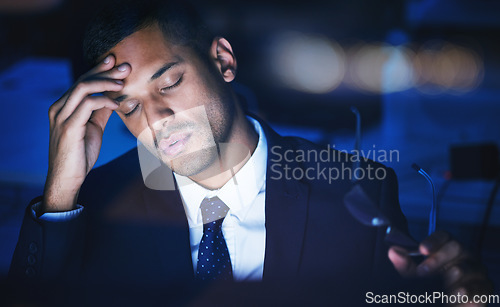 Image of Night, stress and headache of a businessman working overtime or late in dark office for 404 report, IT coding or software deadline. Tired, frustrated or sad corporate information technology manager