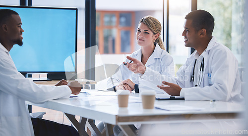 Image of Doctor, meeting and team collaboration of medical professionals in a discussion at a boardroom at the hospital. Diversity in a group of healthcare expert people in communication, teamwork and plan.