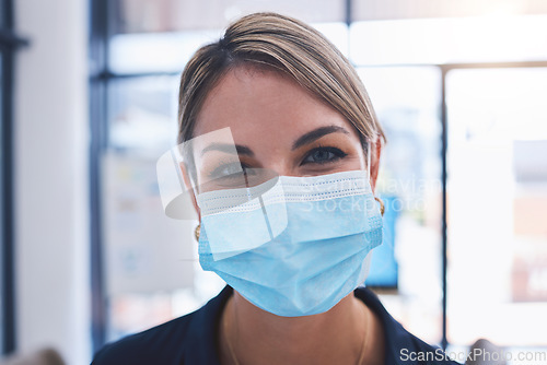 Image of Covid, face and mask with a woman taking safety precaution for health and wellness inside during the corona virus pandemic. Restrictions, regulations and social distancing with a young female