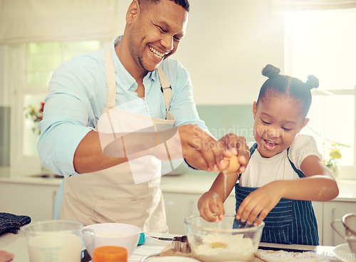 Image of Father, learning girl or baking in home kitchen and cooking a children cake, dessert or breakfast cookies. Fun, happy and comic child with smile in house with bonding family man with health food egg