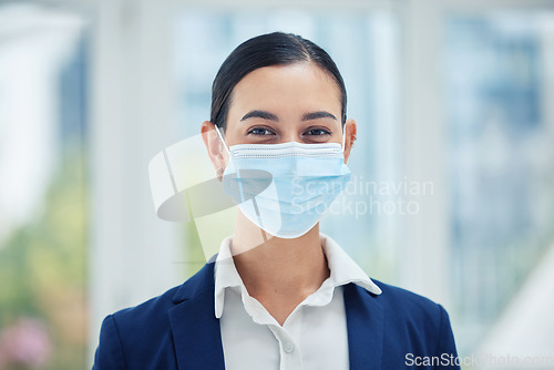 Image of Compliance, face medical mask and covid rules at work with a business woman in corporate office. Portrait of a female worker practice social distancing at workplace, regulations and hygiene