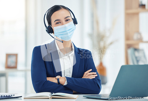 Image of Covid, telemarketing and woman with mask portrait at a corporate work building in the pandemic. Help desk worker at table with medical face protection from coronavirus transmission with staff.