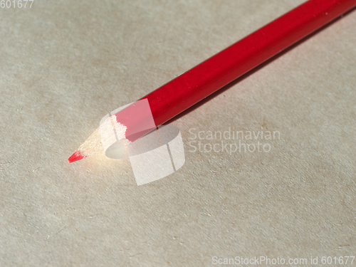 Image of Red pencil over paper