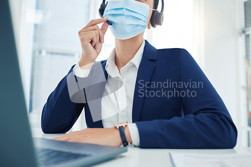 Image of Covid call center, sales woman and marketing agent with face mask networking, talking and consulting with expert communication in office. Telemarketing, crm and business employee in corona pandemic