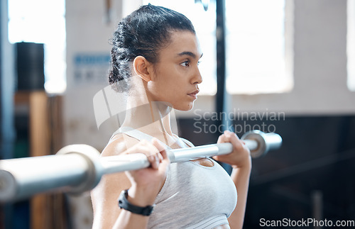 Image of Weight lifting, woman fitness and exercise workout of a bodybuilder with sports motivation and focus. Sport and strength training of a Mexican athlete working out in a wellness, health and gym studio