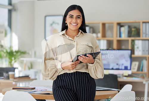 Image of Portrait of happy business woman with digital tablet in a corporate office. Entrepreneur smile, motivation and confident in reaching goal, target and success in her professional career in the company