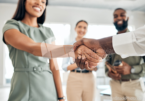 Image of Handshake, teamwork and collaboration with the hands of business people in agreement, deal or thank you in an office at work. Meeting, partnership and welcome with an employee and partner at work