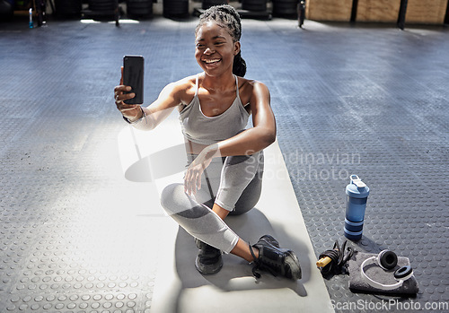 Image of Woman taking selfie with phone at gym, talking on video call with smartphone before workout for fitness training and happy with conversation on tech before exercise. Athlete in conversation at club