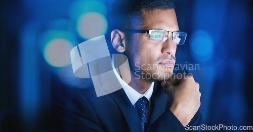 Image of Business, office and man thinking, planning and problem solving at night in a corporate company. Serious and focused male employee in networking, big data and technology for digital innovation.