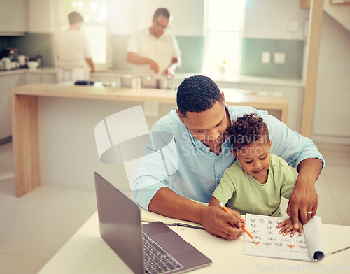 Image of Father, child and learning to color in a book, helpful dad teaching son to hold a pencil at home. Happy family man helping his kid with homework on break from working on laptop in the kitchen.