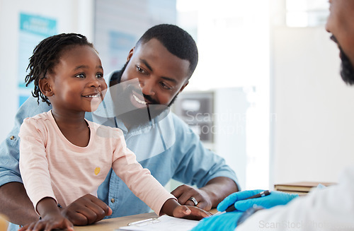 Image of Doctor consultation with a black family, baby and father in a hospital or clinic office for healthcare, insurance and trust. Happy child in a checkup medical appointment with male pediatrician expert