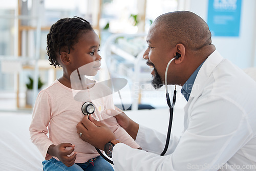 Image of Kids doctor, stethoscope and consulting hospital worker in medical help, insurance exam or lung test. Happy smile or pediatrician healthcare employee with girl patient in children medicine cardiology