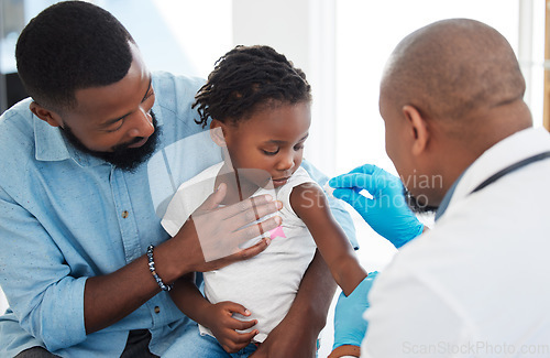 Image of Healthcare, vaccine and doctor with child patient cleaning shoulder with hygiene material with help or support of father. Kid at appointment with medical professional clean arm for shot or injection