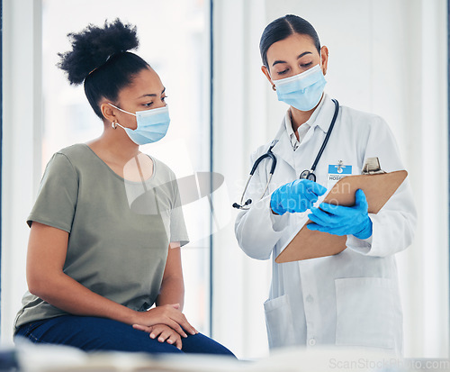 Image of Covid, consulting and healthcare with a doctor and patient reading medical paperwork on a clipboard with test results. Insurance, medicine and help with a woman in the hospital for an appointment