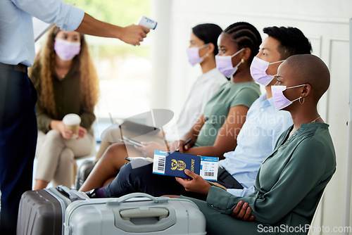 Image of Covid, travel and airport with security scanning a woman with an infrared thermometer for temperature. Immigration, restrictions and passport with a female passenger getting ready to board a flight