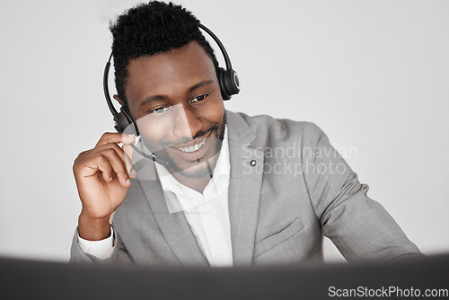 Image of Customer support, call center and crm with a business man consulting on a call with a headset. Contact us, telemarketing and sales with a consultant in an office for help, assistance and service