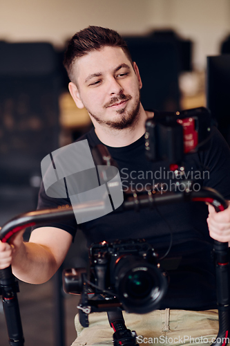 Image of A professional videographer using modern equipment to capture compelling visuals, showcasing expertise and creativity in the art of video production.