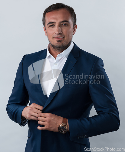 Image of Young beautiful focused european businessman. Front view of man with dark hair clothing casual business formal jacket Isolated on gray background