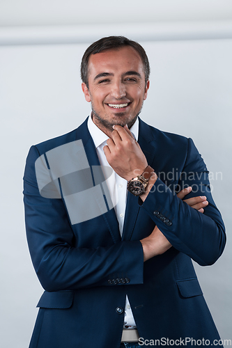 Image of Young beautiful focused european businessman. Front view of man with dark hair clothing casual business formal jacket Isolated on gray background