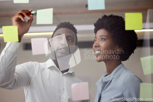 Image of Black people, writing and thinking of idea on post it wall for brainstorming meeting pitch. Innovation, strategy and development of business goal with professional corporate planning team.