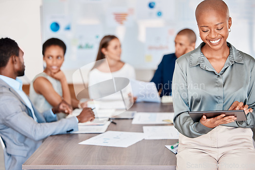 Image of Business woman working on digital tablet while in team meeting analyzing documents and paperwork. Diversity, corporate and professional group of people doing research and planning a project in office