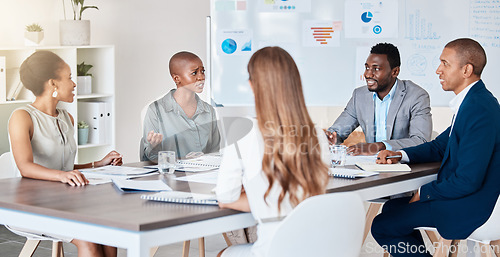 Image of Business people planning, collaboration and teamwork on a startup project in an advertising or marketing company. Team of professional workers working on strategy with data documents or paperwork