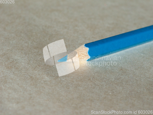 Image of Blue pencil over paper