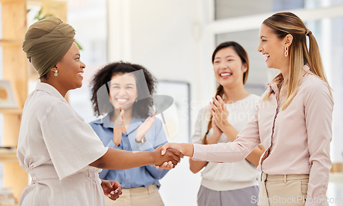 Image of Handshake, promotion or welcome, happy business women meeting in office. Success, teamwork and empowerment in diversity, black woman shaking hands with lady manager after interview, contract or deal.